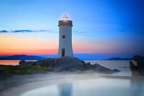 Lighthouse over the blue sky in Sardinia, Italy