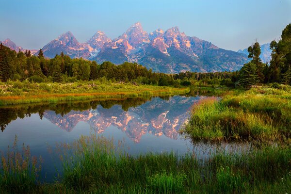 A chain of mountains in the reflection of water