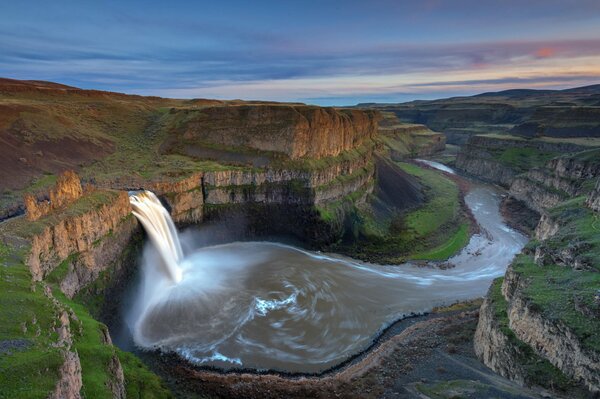 View of the waterfall from the top of the rocks