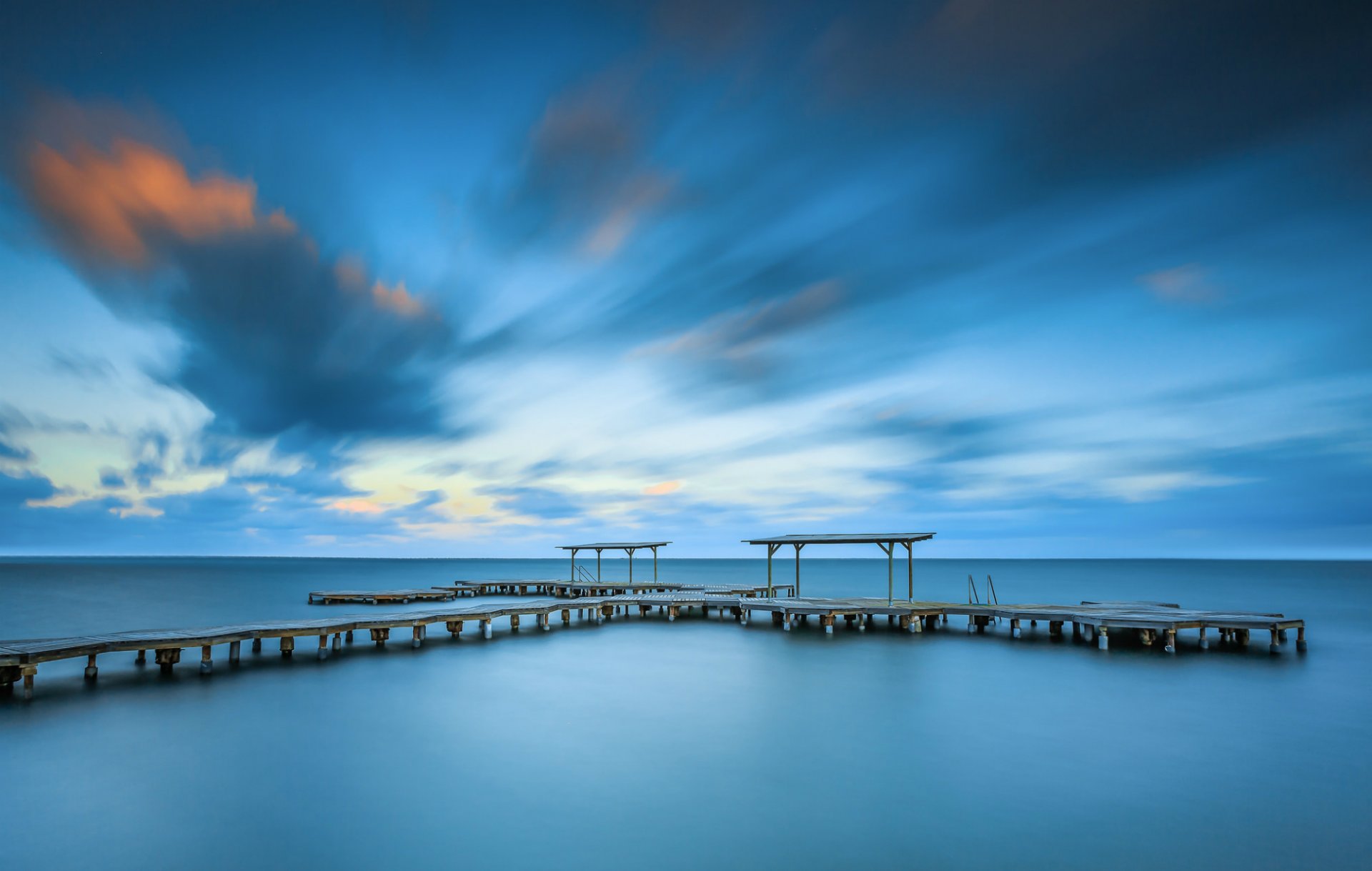 espagne mer calme pont jetée côte soir ciel nuages