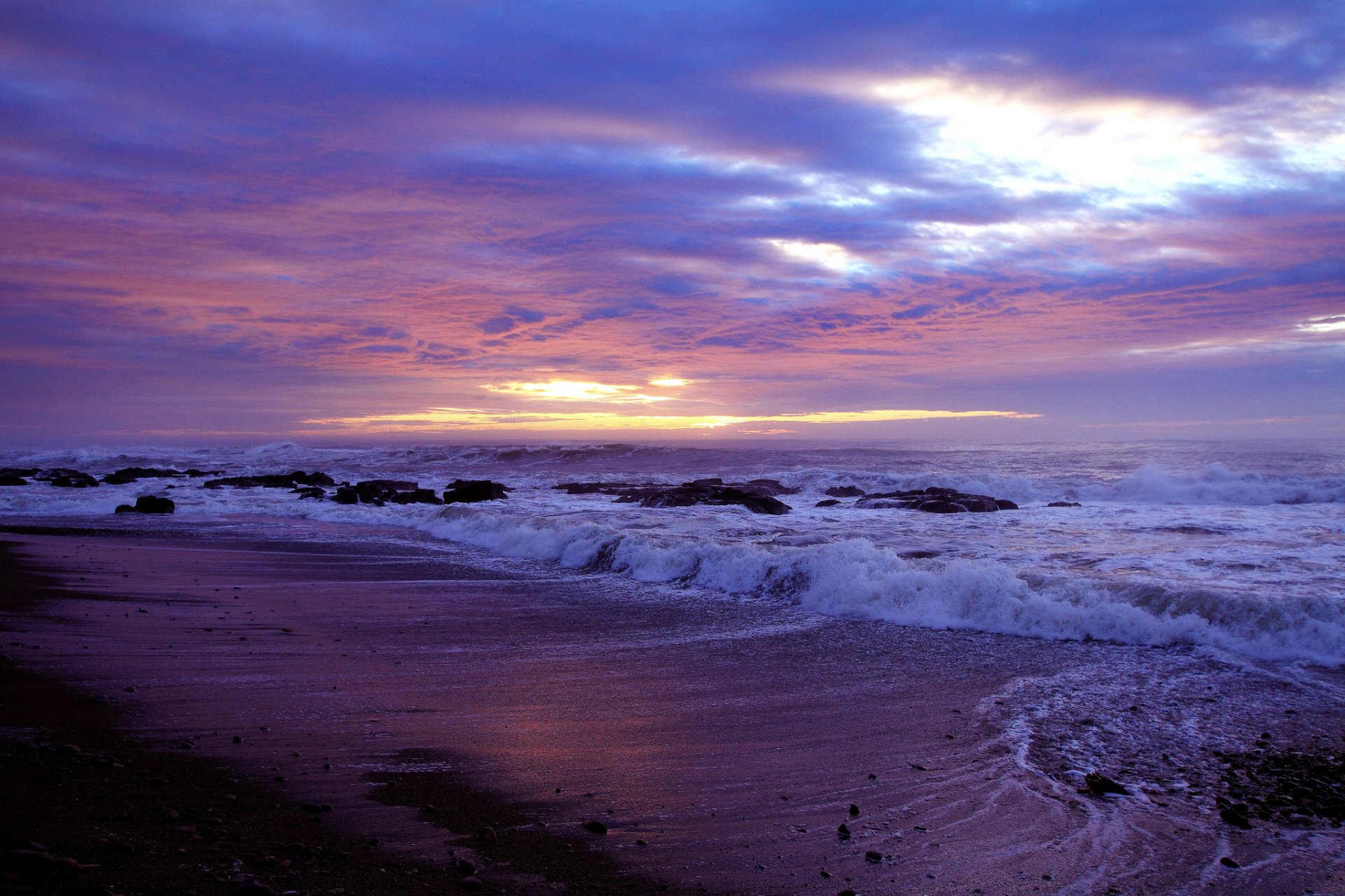 beach stones sea waves sunset