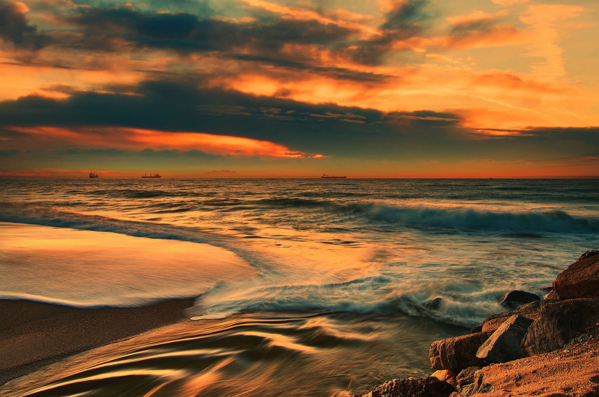 ea beach stones waves ships horizon night sunset