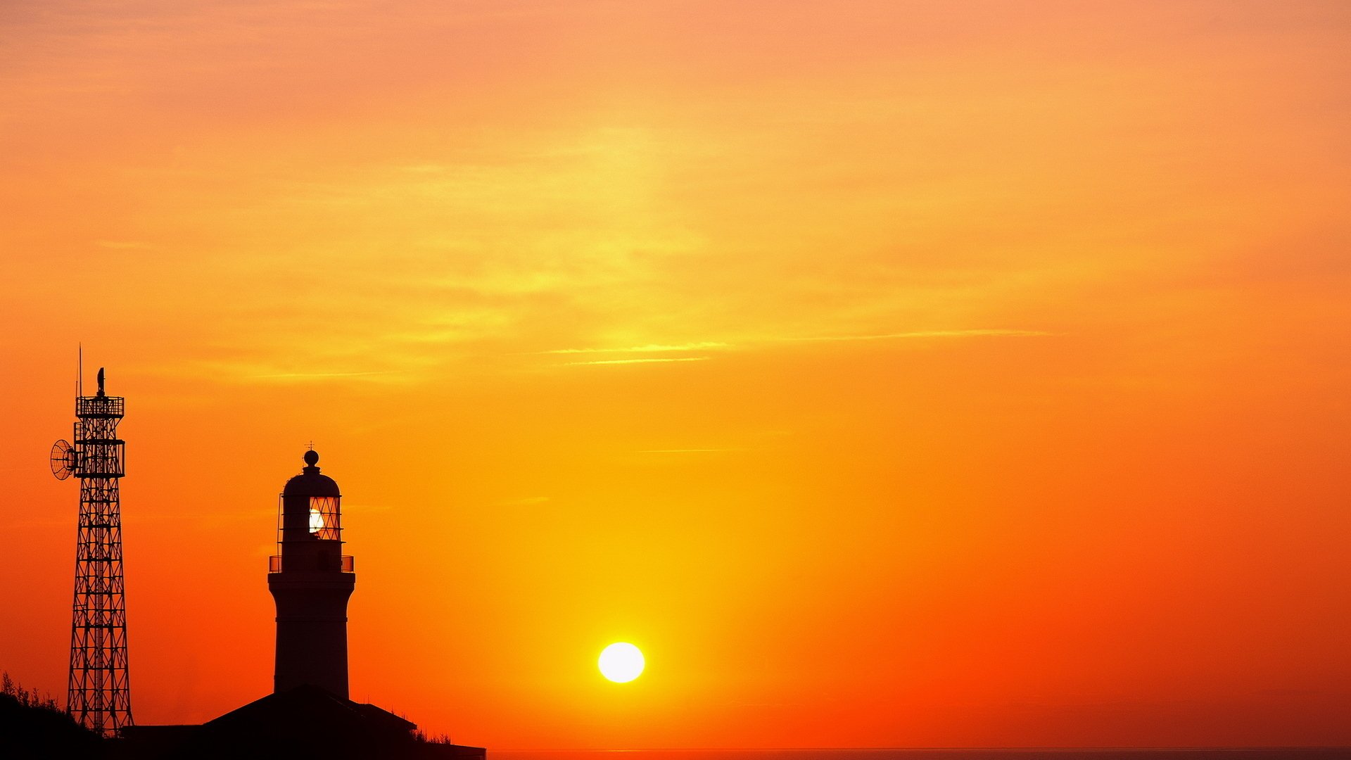 lighthouse the tower sun sky cloud