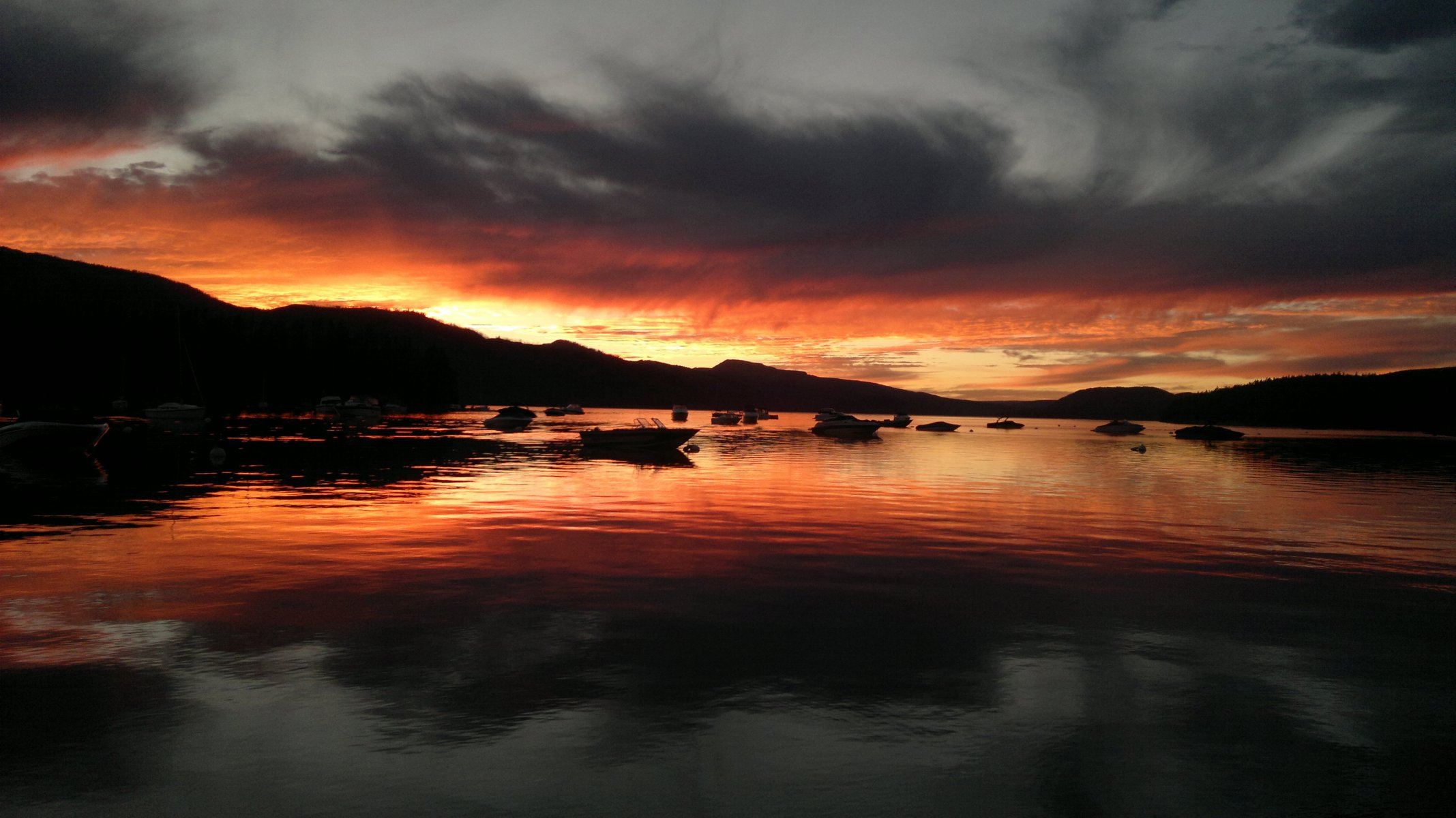 unset stones sky lake boat