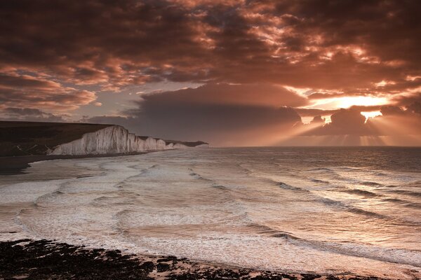 The undulating coast in the rays of heavenly light