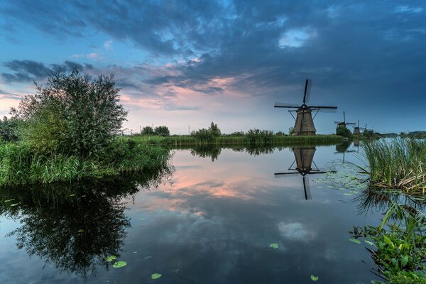 The reflection of the sky in the water. Windmill