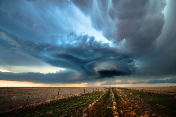 Fabulous clouds in the field. Landscape