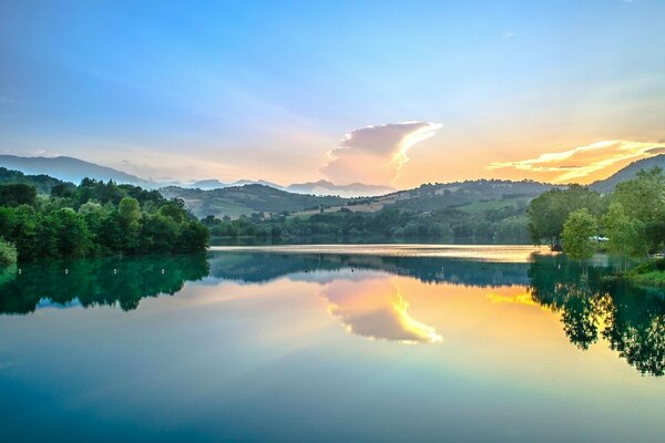 Italy the dawn is reflected in the river