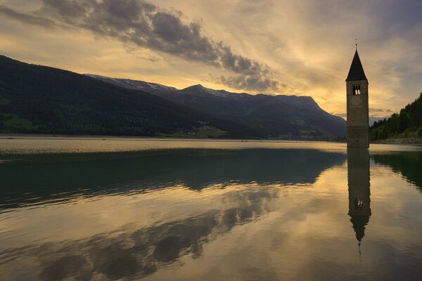 Lake and mountains at evening sunset