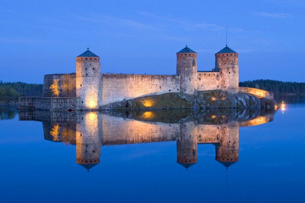 Castle with towers on the lake shore