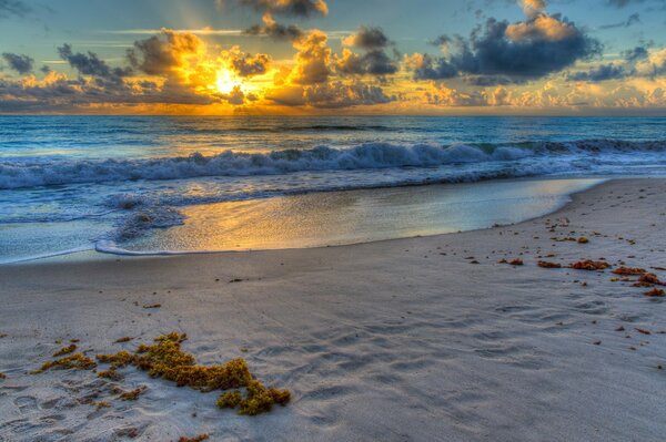 Ocean waves setting on a sandy beach