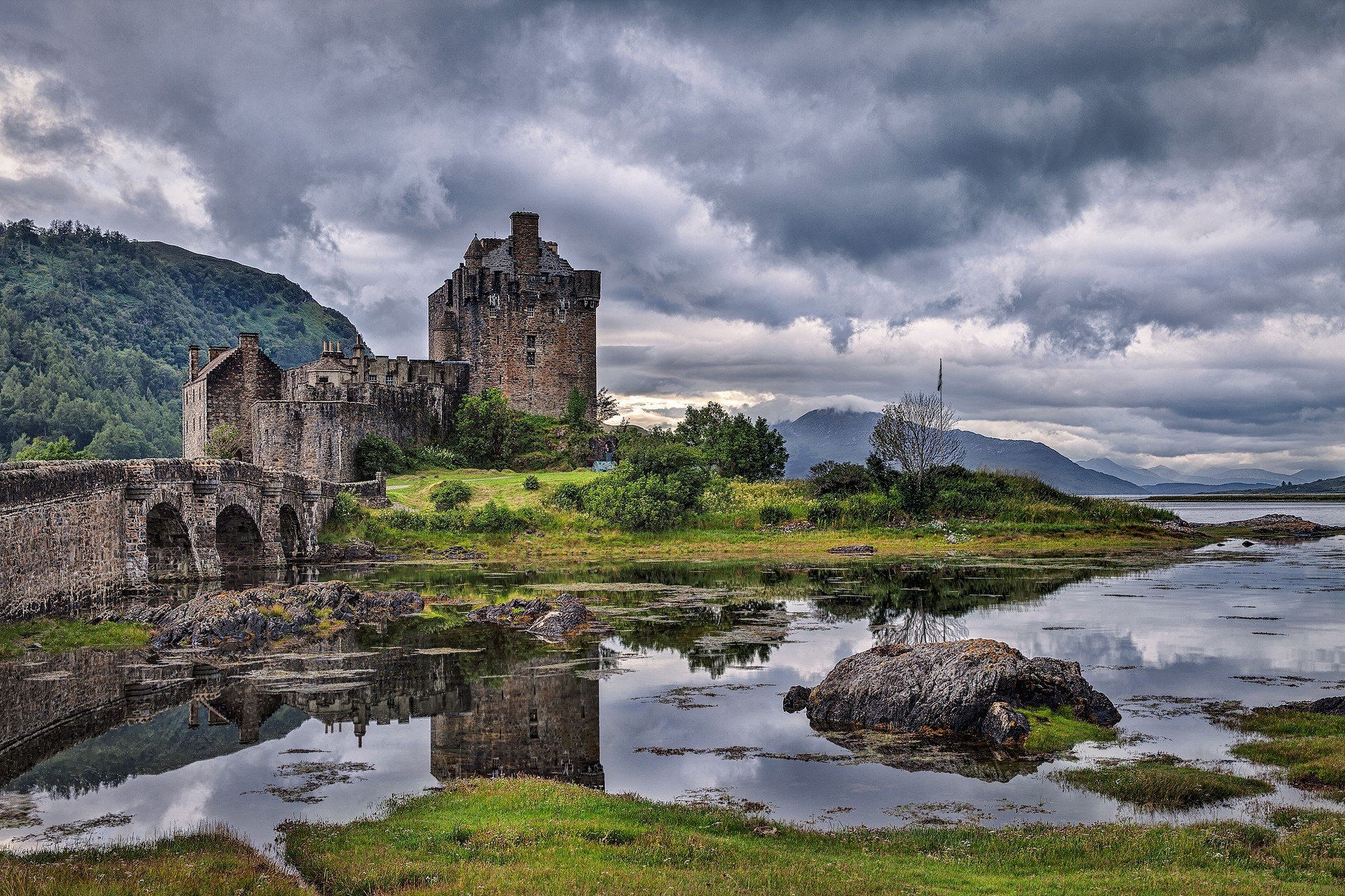 cotland sky clouds castle mountain river bridge grass stone