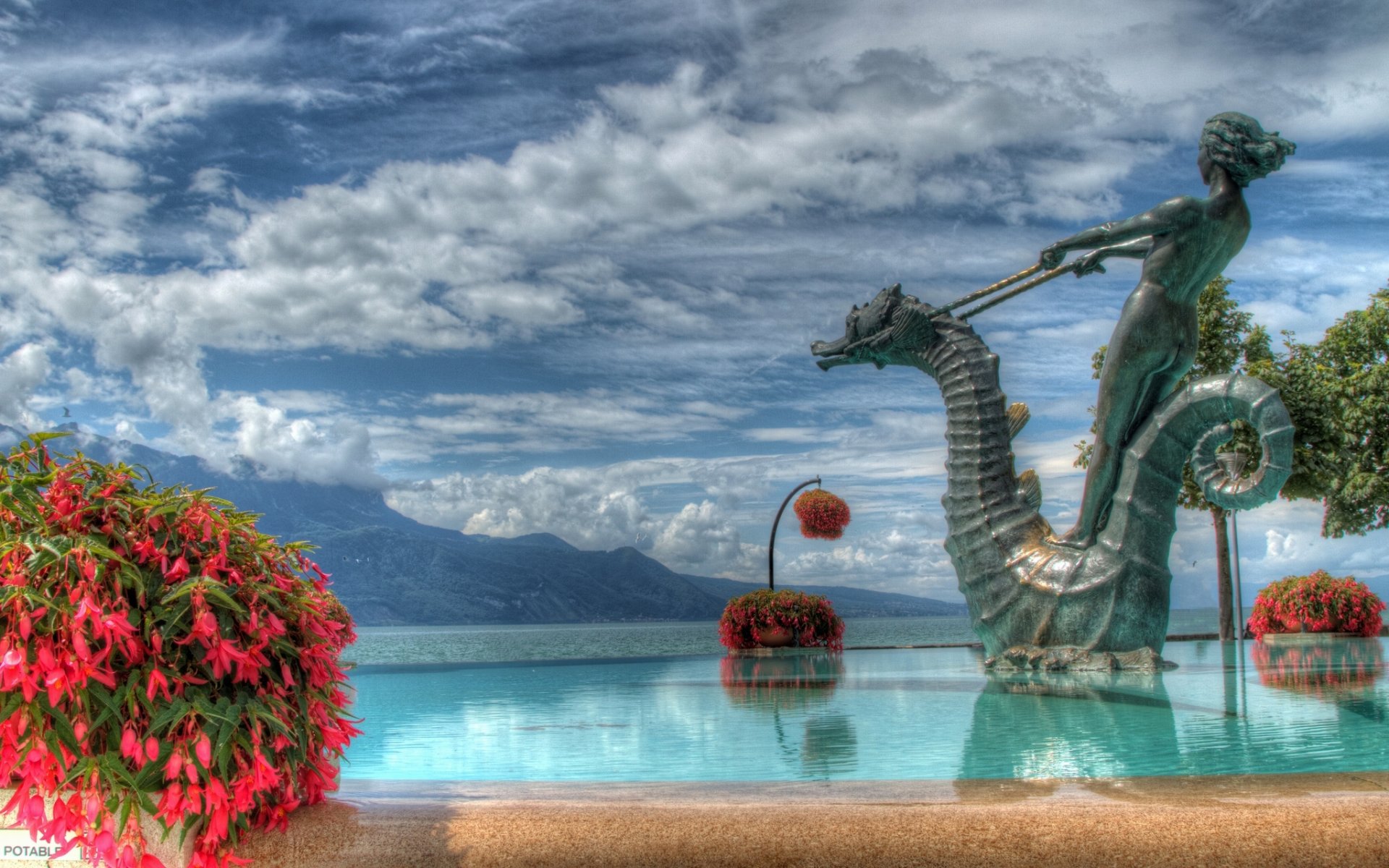 vevey switzerland lake geneva flower fountain sculpture landscape