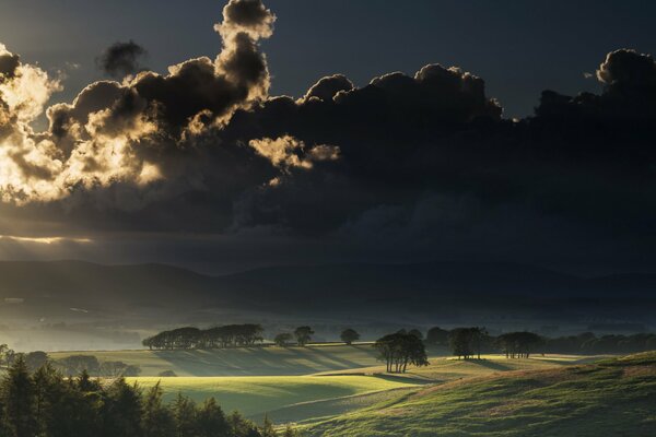 Dark sunset in a green valley