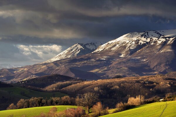 Green valley on the background of mountains